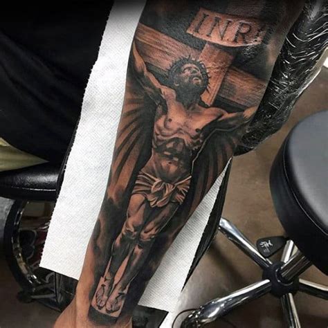 jesus christ forearm tattoo|jesus carrying the cross tattoos.